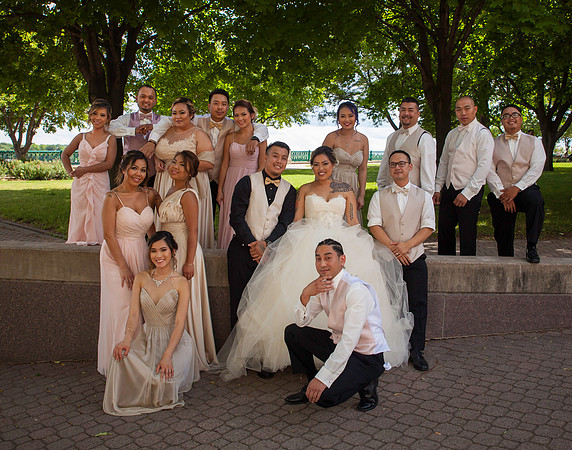 A Bridal Party Portait from a Laotian Wedding.  The Bridesmaids are dressed in blush pink,the grooms men has champagne colored vests