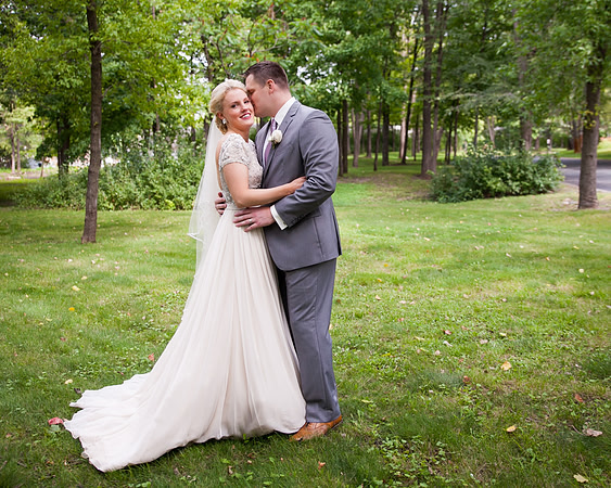 A-groom-whispers-to-his future-wife.jpg