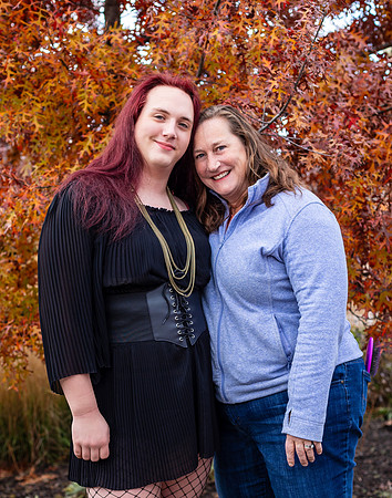 A Mother with red hair poses with her red headed trans daughter