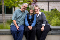 An inclusive family poses in their family portraits